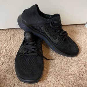 Solid black Nike frees 9.5 woman’s